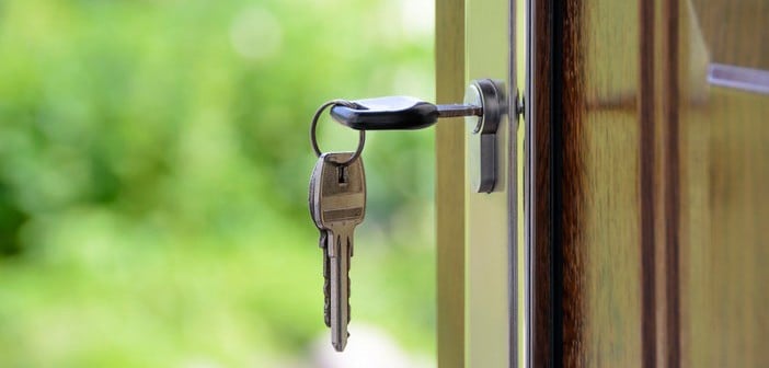 closeup of key in lock on door