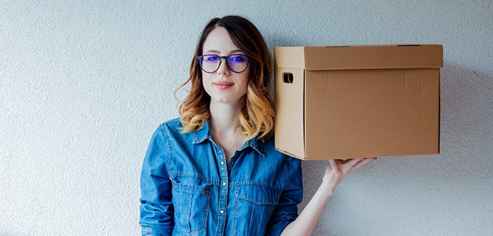 woman holding a moving box