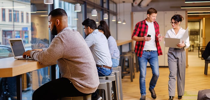 Young specialists in coworking office.