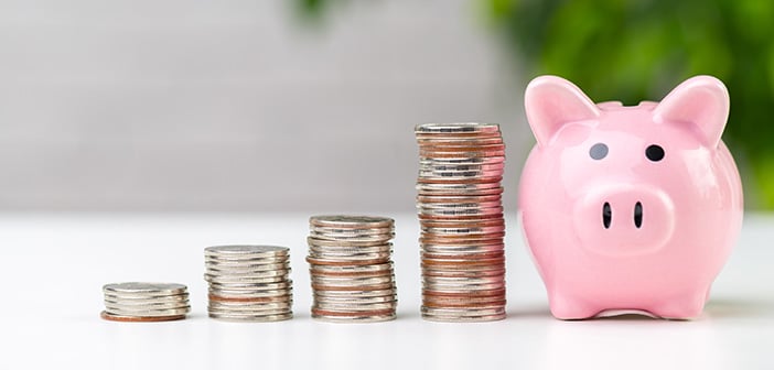 piggy bank with coins on a table