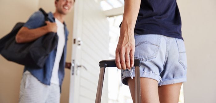 ouple With Luggage Leaving Home For Vacation