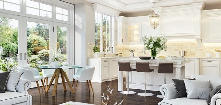 Luxurious white kitchen and living room in a big house