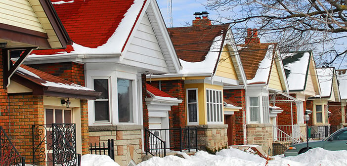 Row of residential houses in winter with snow