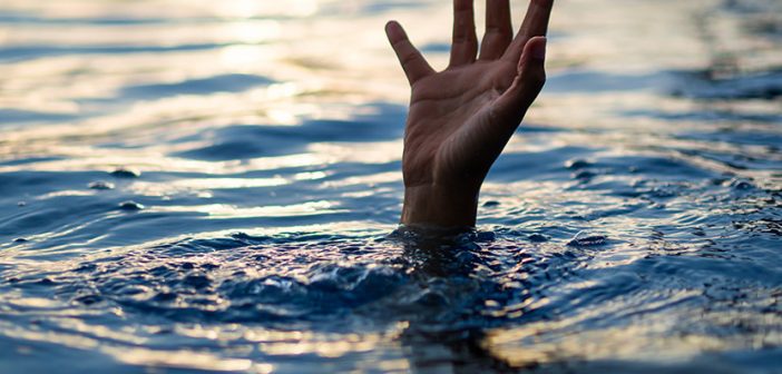 Drowning victims, Hand of drowning man needing help. Failure and rescue concept.