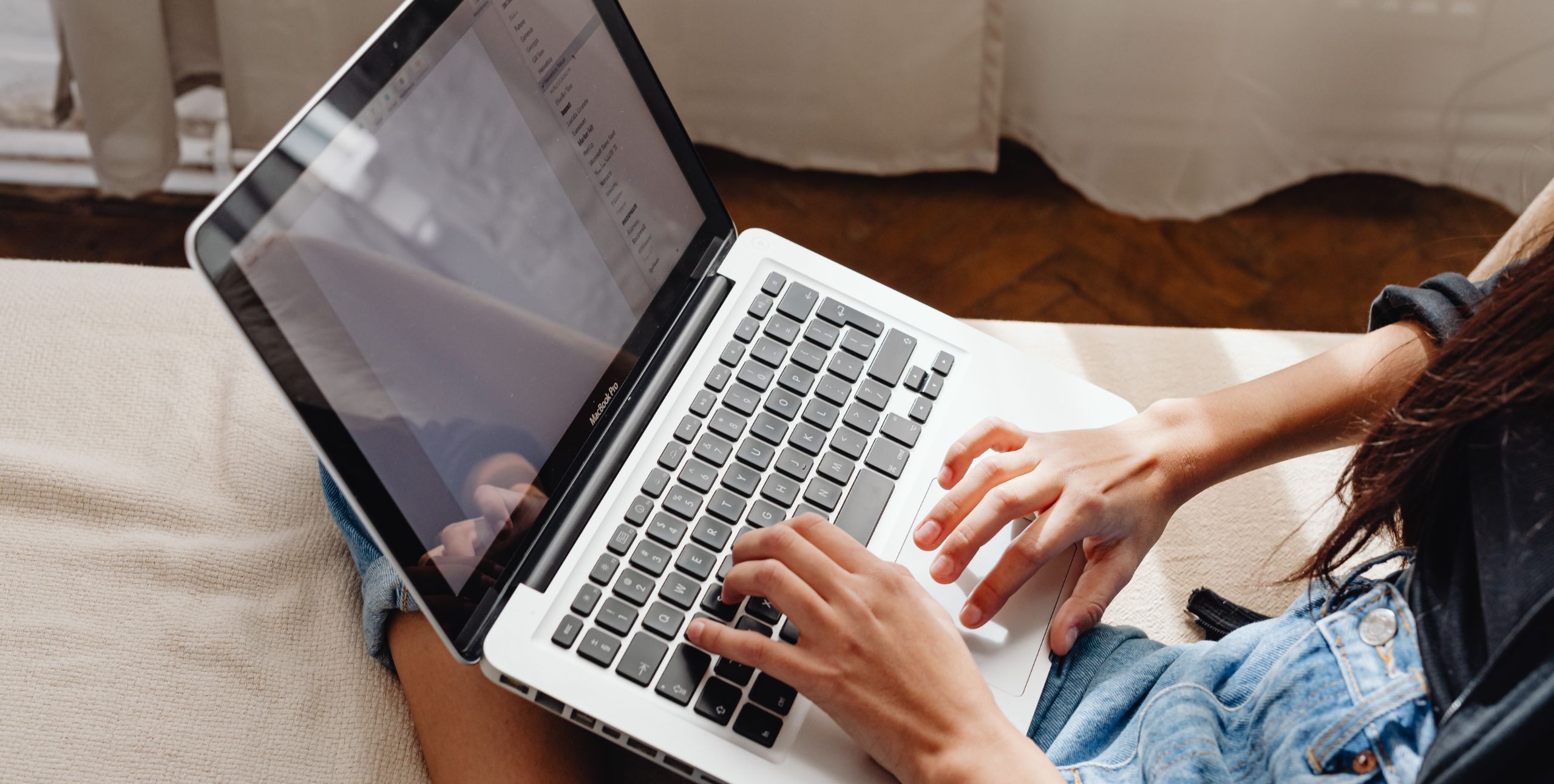 person on a computer to show real estate marketing concept