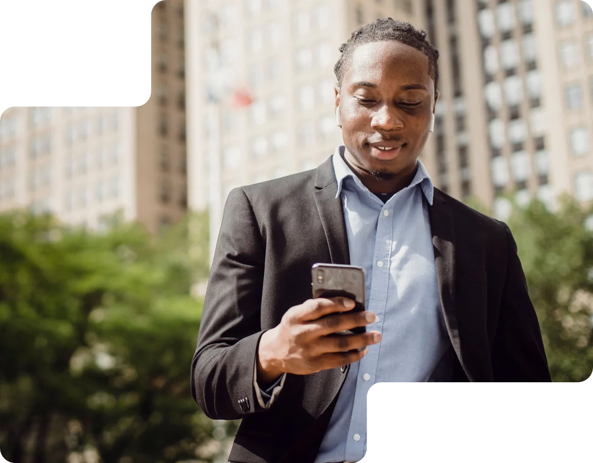 A real estate agent checking new investor leads on a phone