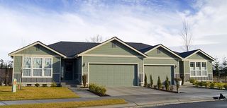 duplex with green siding