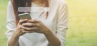 Woman uses a smartphone to find what you are interested. Searching information data on internet networking concept