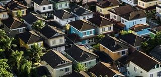 aerial shot of neighborhood with two-story houses close together