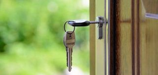 closeup of key in lock on door