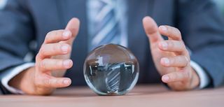 Businessman forecasting a crystal ball